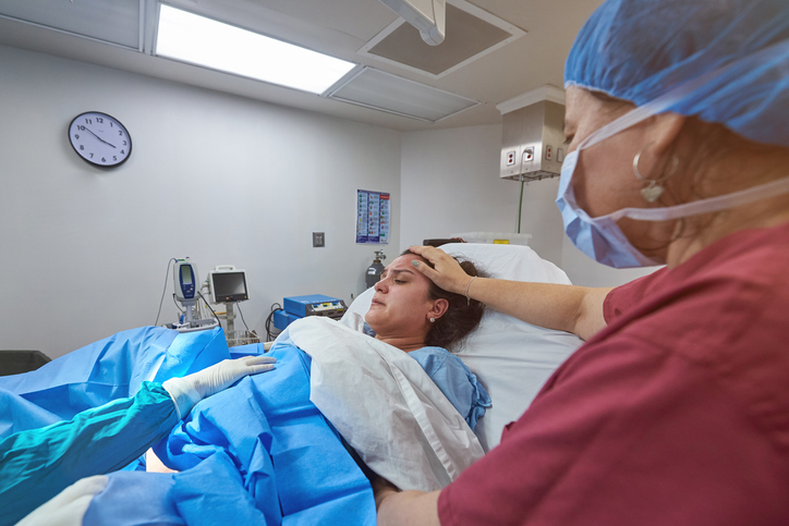 Woman giving birth