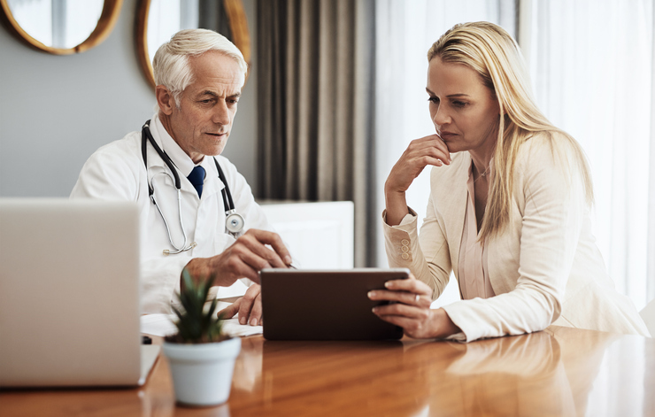 Doctor speaking to woman