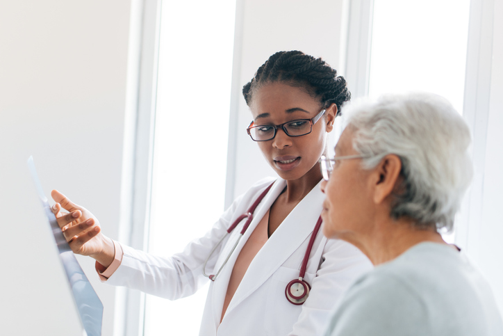 Doctor speaking with woman