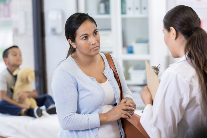 Doctor speaking with patient
